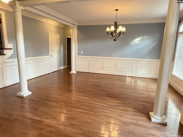 601 Cartgate Cir, Blythewood, SC 29016 - unfurnished dining area with ornate columns, ornamental molding, wood finished floors, a chandelier, and wainscoting