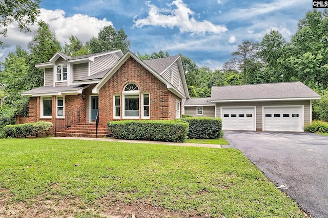 156 Whisperwood Dr, Lexington, SC 29072 - traditional home featuring asphalt driveway, brick siding, an attached garage, a front yard, and a shingled roof