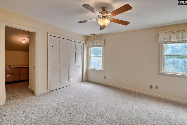 156 Whisperwood Dr, Lexington, SC 29072 - unfurnished bedroom with carpet floors, a closet, baseboards, and a ceiling fan