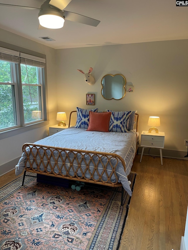 210 S Waccamaw Ave, Columbia, SC 29205 - bedroom with wood finished floors, a ceiling fan, and baseboards