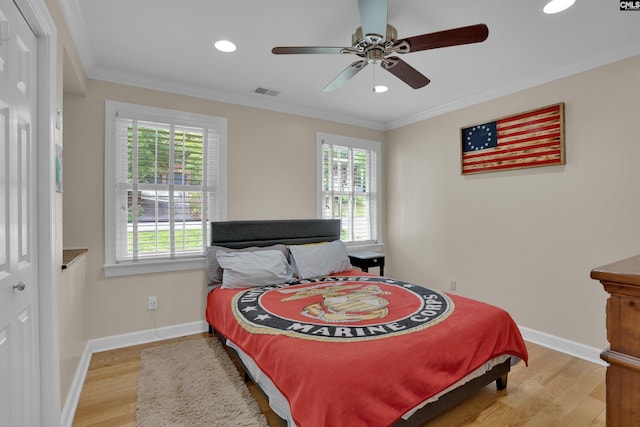 531 Sulgrave Dr, Columbia, SC 29210 - bedroom with multiple windows, wood finished floors, ornamental molding, recessed lighting, and baseboards