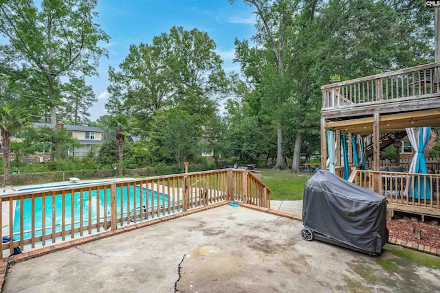 531 Sulgrave Dr, Columbia, SC 29210 - view of patio / terrace featuring an outdoor pool, a deck, view of scattered trees, and grilling area