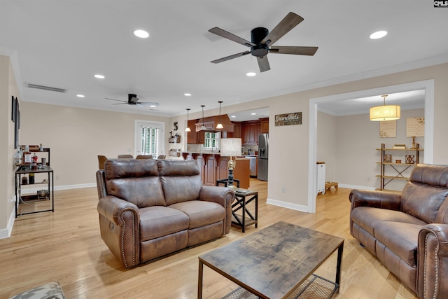 531 Sulgrave Dr, Columbia, SC 29210 - living room featuring a ceiling fan, recessed lighting, crown molding, baseboards, and light wood-style floors