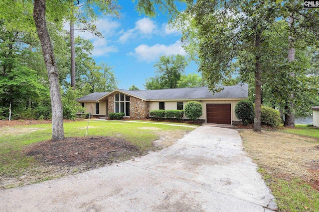 320 N Chelsea Rd, Columbia, SC 29223 - mid-century home featuring an attached garage, concrete driveway, and a front yard