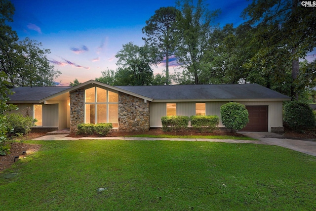 320 N Chelsea Rd, Columbia, SC 29223 - view of front of house with stone siding, a garage, concrete driveway, and a front lawn