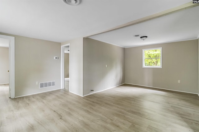 3201 Wilton Rd, West Columbia, SC 29170 - empty room with light wood-style flooring, baseboards, and crown molding