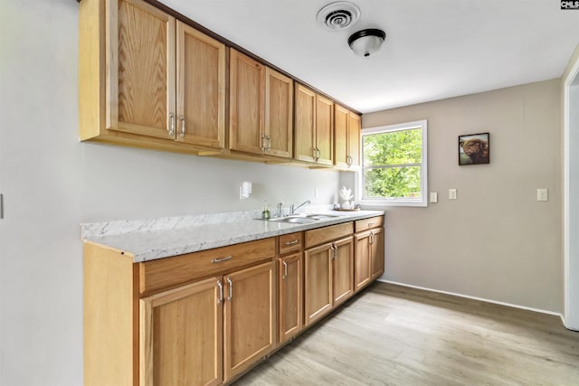 3201 Wilton Rd, West Columbia, SC 29170 - kitchen with a sink, light wood finished floors, and baseboards