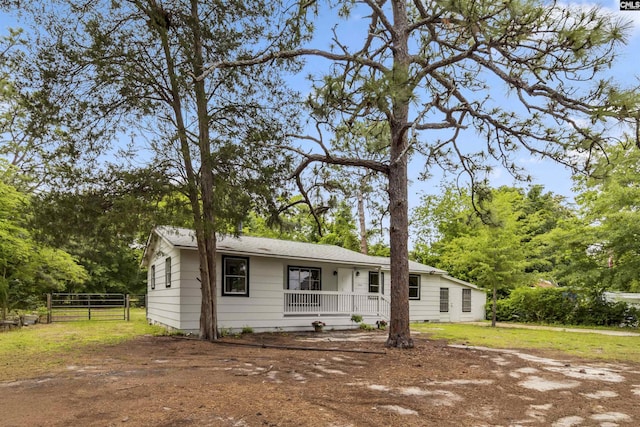 3201 Wilton Rd, West Columbia, SC 29170 - ranch-style house with a porch and view of scattered trees