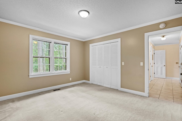 117 Brookspring Rd, Columbia, SC 29223 - unfurnished bedroom featuring ornamental molding, a textured ceiling, carpet floors, a closet, and baseboards