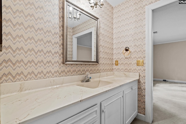 117 Brookspring Rd, Columbia, SC 29223 - bathroom with wallpapered walls, vanity, baseboards, and a chandelier