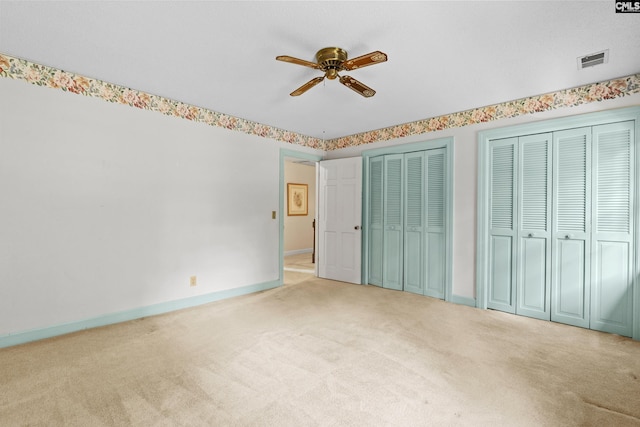 117 Brookspring Rd, Columbia, SC 29223 - unfurnished bedroom with light carpet, two closets, baseboards, and ceiling fan