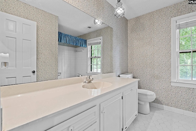 117 Brookspring Rd, Columbia, SC 29223 - bathroom with wallpapered walls, tile patterned floors, toilet, vanity, and plenty of natural light