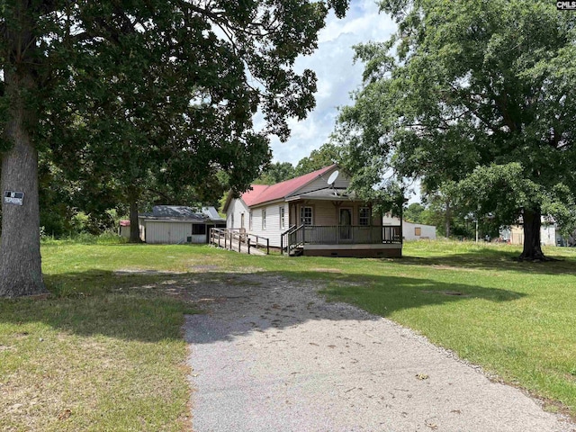 127 Dry Gulch Rd, Saluda, SC 29138 - view of front of property featuring a front lawn, crawl space, driveway, and a porch
