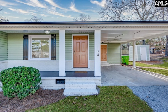 104 Big John Rd, Elgin, SC 29045 - doorway to property featuring an attached carport, gravel driveway, and a porch