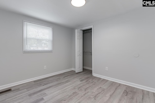104 Big John Rd, Elgin, SC 29045 - unfurnished bedroom featuring wood finished floors, baseboards, and a closet