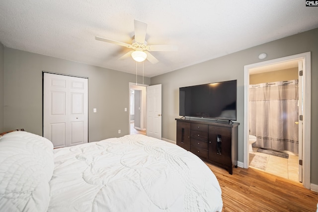144 Stephanie Dr, Lexington, SC 29073 - bedroom featuring light wood-type flooring, a closet, a ceiling fan, and baseboards