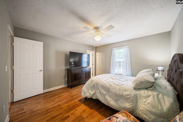 144 Stephanie Dr, Lexington, SC 29073 - bedroom featuring wood finished floors, baseboards, a textured ceiling, and a ceiling fan