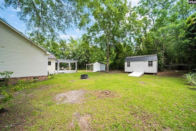 144 Stephanie Dr, Lexington, SC 29073 - view of grassy yard featuring an outdoor fire pit and a pergola