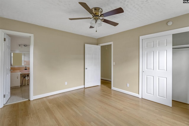 1629 B Ave, West Columbia, SC 29169 - unfurnished bedroom featuring light wood-style floors, baseboards, connected bathroom, ceiling fan, and a closet