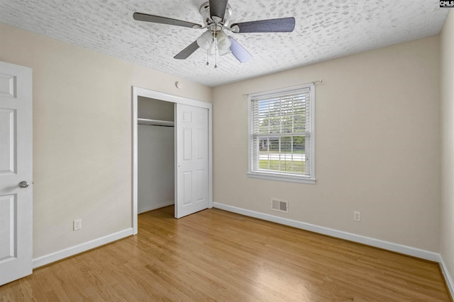1629 B Ave, West Columbia, SC 29169 - unfurnished bedroom featuring baseboards, light wood-style flooring, a closet, a textured ceiling, and ceiling fan