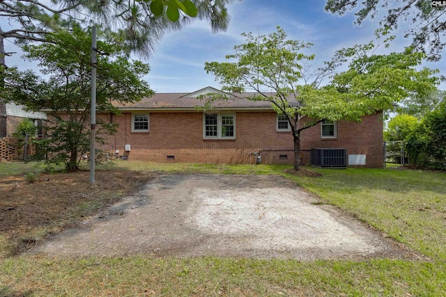 1629 B Ave, West Columbia, SC 29169 - rear view of house featuring crawl space, brick siding, a lawn, and a patio