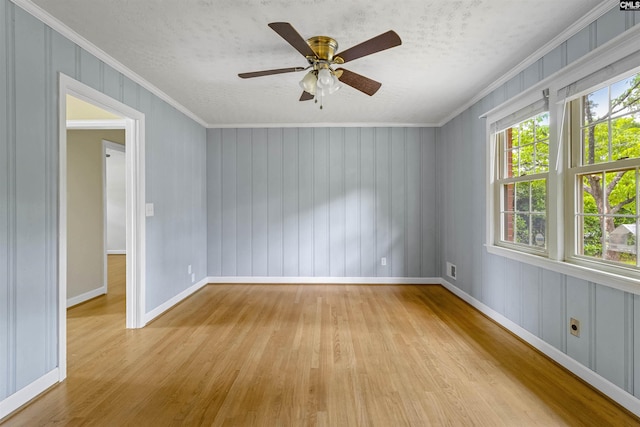 1629 B Ave, West Columbia, SC 29169 - empty room with wood finished floors, ornamental molding, baseboards, a ceiling fan, and a textured ceiling