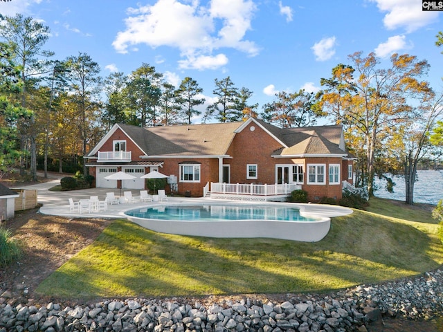 208 Ballentine Ln, Chapin, SC 29036 - rear view of house featuring brick siding, an outdoor pool, a yard, a patio, and a wooden deck