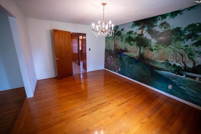 109 Mcrae St, Columbia, SC 29203 - unfurnished room featuring a chandelier, wood finished floors, and baseboards