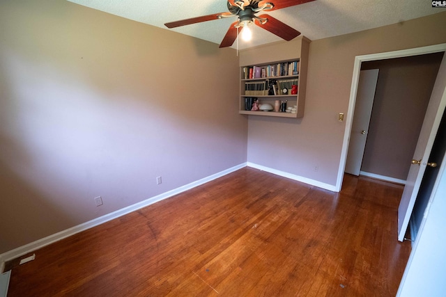 109 Mcrae St, Columbia, SC 29203 - empty room featuring a ceiling fan, wood finished floors, baseboards, and a textured ceiling
