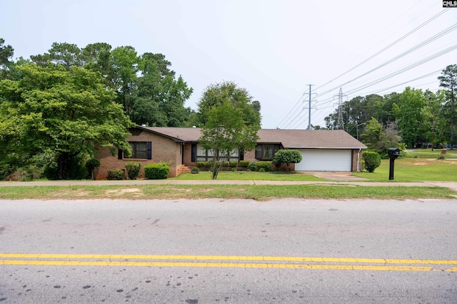 109 Mcrae St, Columbia, SC 29203 - single story home featuring brick siding, a front lawn, driveway, and an attached garage