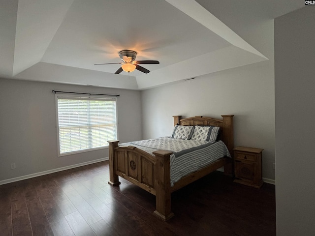 925 Corison Loop, Columbia, SC 29229 - bedroom with a raised ceiling, baseboards, dark wood-style floors, and a ceiling fan