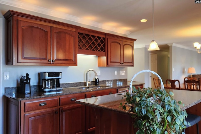 429 Forest Shores Rd, Prosperity, SC 29127 - kitchen with a sink, pendant lighting, dark stone countertops, crown molding, and recessed lighting