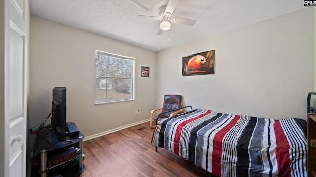 530 Pin Oak Dr, Lexington, SC 29073 - bedroom with a textured ceiling, wood finished floors, baseboards, and a ceiling fan