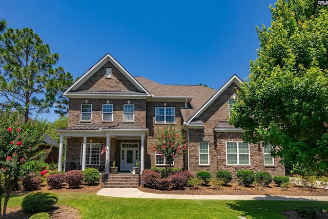 215 Peninsula Way, Columbia, SC 29229 - view of front of house with a front lawn, covered porch, a standing seam roof, and brick siding