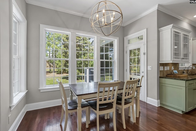 215 Peninsula Way, Columbia, SC 29229 - dining area featuring dark wood finished floors, a chandelier, baseboards, and crown molding