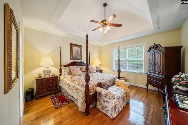 55 Hickory Woods Ct, Columbia, SC 29223 - bedroom featuring a raised ceiling, light wood-style floors, baseboards, and a ceiling fan
