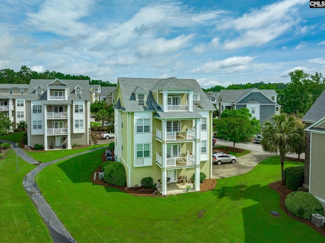 138 Breezes Dr Unit 34C, Lexington, SC 29072 - back of property with a balcony, a residential view, and a yard