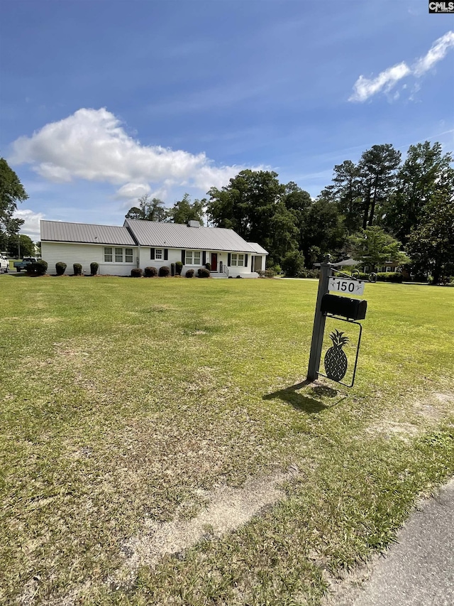 150 Azalea Ave, Bamberg, SC 29003 - view of front of house with a front yard and metal roof