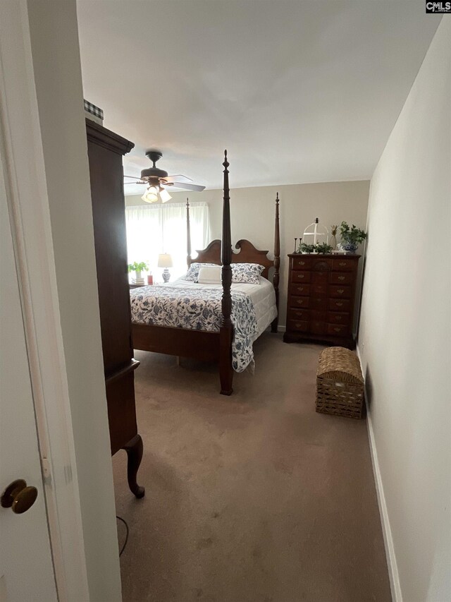 150 Azalea Ave, Bamberg, SC 29003 - bedroom featuring light colored carpet, ceiling fan, and baseboards
