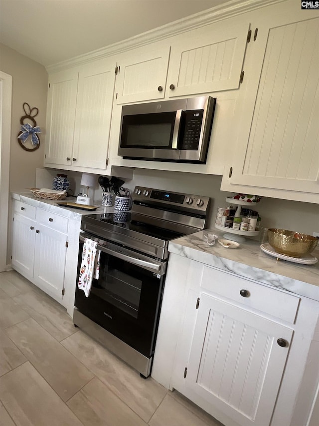 150 Azalea Ave, Bamberg, SC 29003 - kitchen featuring stainless steel appliances, light countertops, and white cabinetry