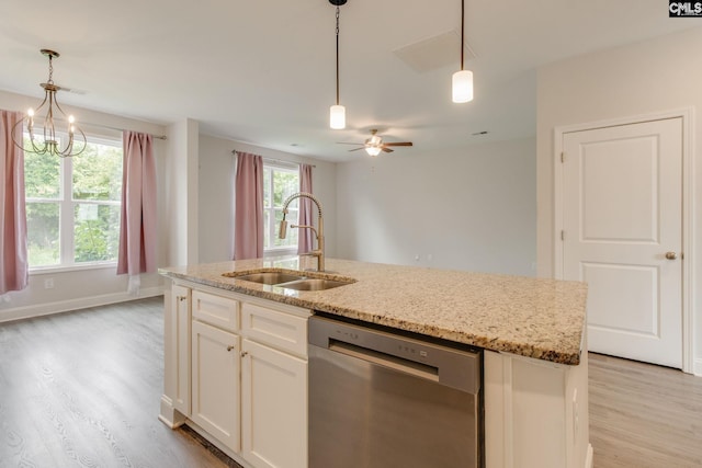412 Blue Robin Ln, Columbia, SC 29210 - kitchen with dishwasher, a sink, light wood finished floors, and light stone counters