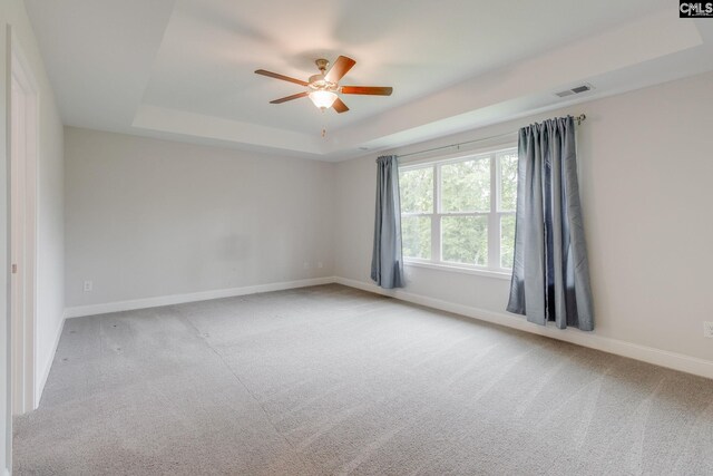 412 Blue Robin Ln, Columbia, SC 29210 - empty room with a raised ceiling, ceiling fan, baseboards, and carpet floors