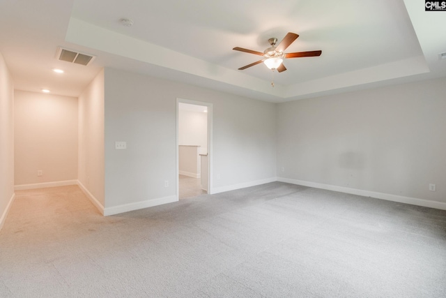 412 Blue Robin Ln, Columbia, SC 29210 - empty room with light colored carpet, a ceiling fan, baseboards, recessed lighting, and a tray ceiling
