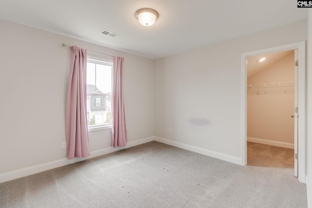 412 Blue Robin Ln, Columbia, SC 29210 - unfurnished bedroom with carpet, a spacious closet, baseboards, and a closet