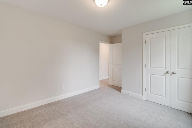 412 Blue Robin Ln, Columbia, SC 29210 - unfurnished bedroom with light colored carpet, a closet, and baseboards