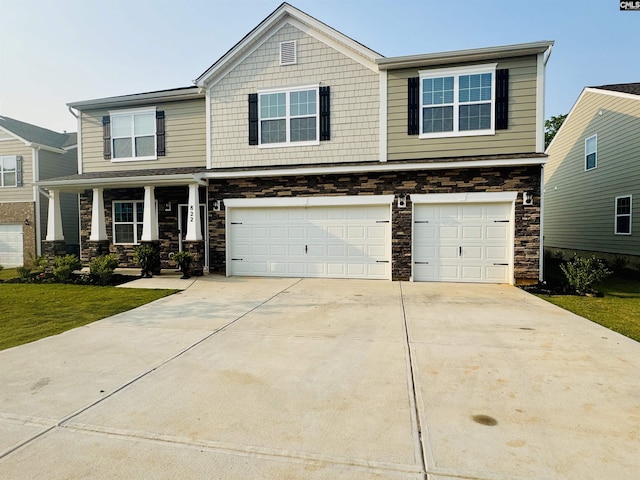 822 Marigold Ln, Lexington, SC 29072 - view of front of home with a garage, stone siding, concrete driveway, a porch, and a front yard
