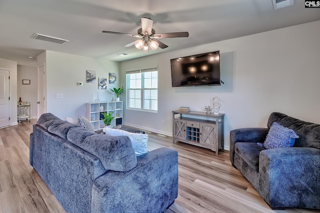 2426 Trakand Dr, Lexington, SC 29073 - living area with a ceiling fan, baseboards, and light wood-style flooring