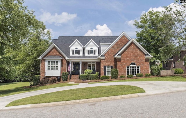 15 Clay Ct, Chapin, SC 29036 - traditional-style home featuring brick siding, a front lawn, curved driveway, and a porch