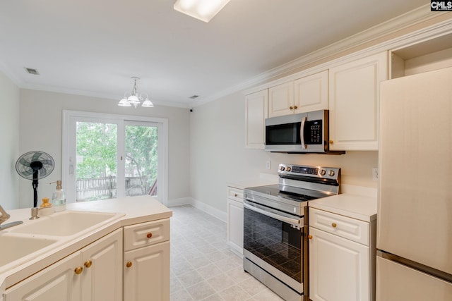311 Hillridge Way, Columbia, SC 29229 - kitchen featuring stainless steel appliances, a chandelier, ornamental molding, baseboards, and light countertops