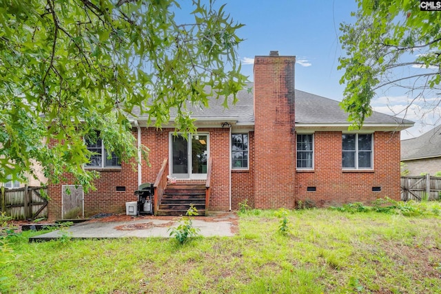311 Hillridge Way, Columbia, SC 29229 - back of house featuring crawl space, entry steps, brick siding, a chimney, and a patio area